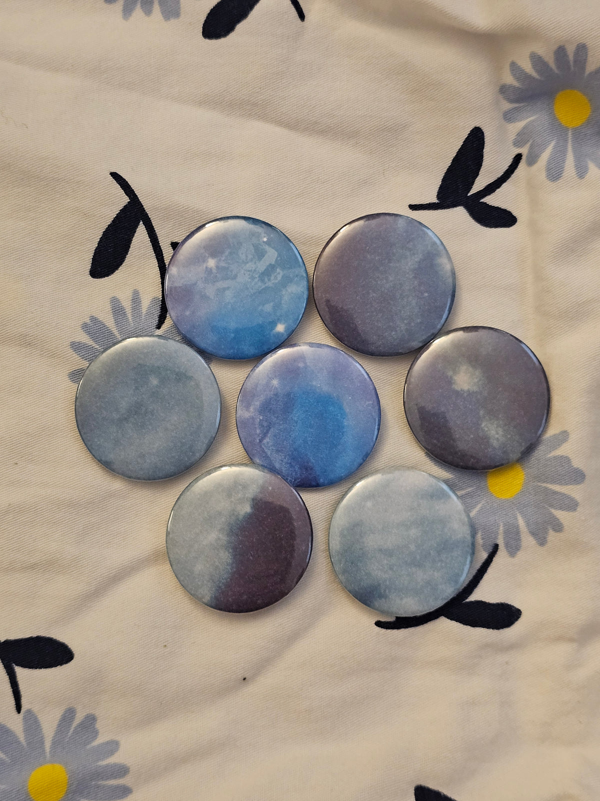 1.25" blue skies mystery button pin